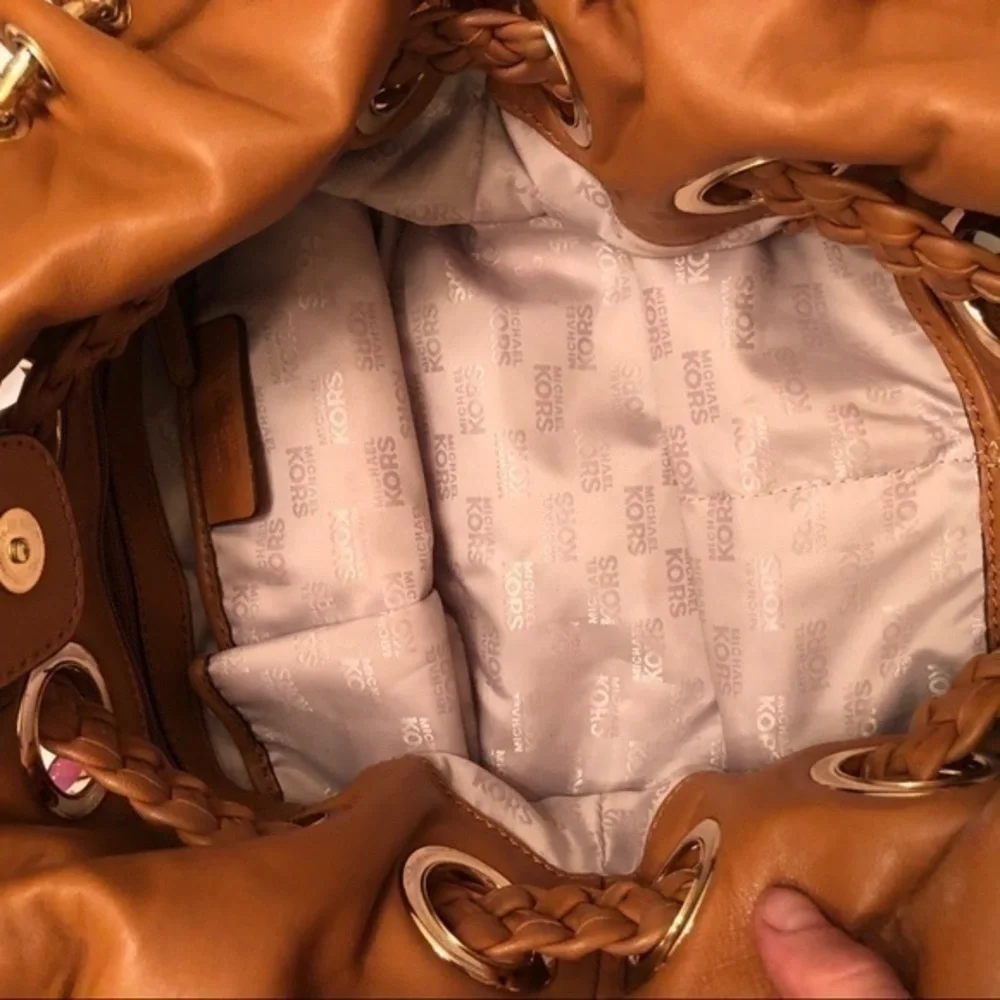 Michael kors brown leather grommet tassel bag